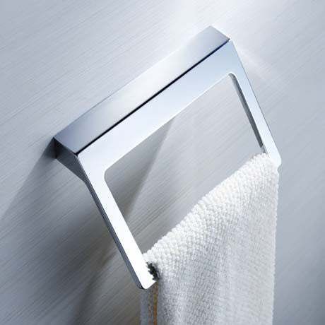A wall mounted toilet towel holder. A piece of bathroom accessory to hold towel.