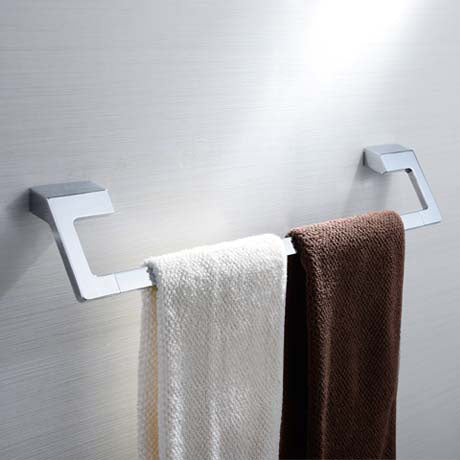 A piece of wall mounted chrome bathroom accessory towel rack to hold towel.