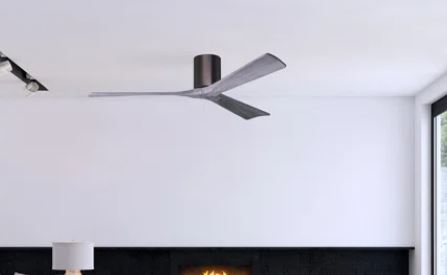 Ceiling fan mounted on a white ceiling with a fireplace and mirror in the background.