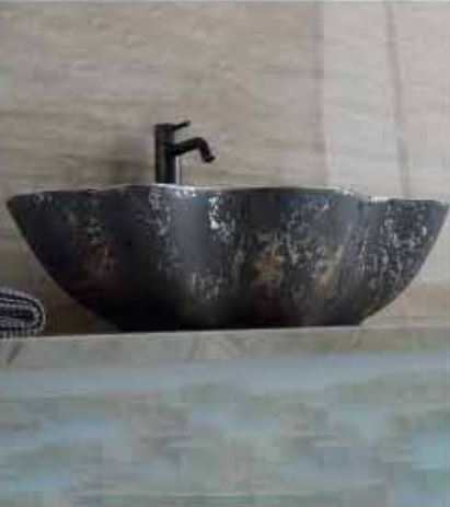 A luxurious black and white marble bathroom sink with a modern faucet.