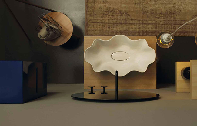 A modern white countertop washbasin with a unique design, perfect for luxurious bathrooms