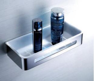 A stainless steel shower basket with two bottles of shampoo or conditioner.