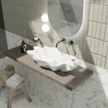 Modern countertop washbasin with a white ceramic shell-like design, placed on a brown countertop with a mirror above it, in a bathroom setting.