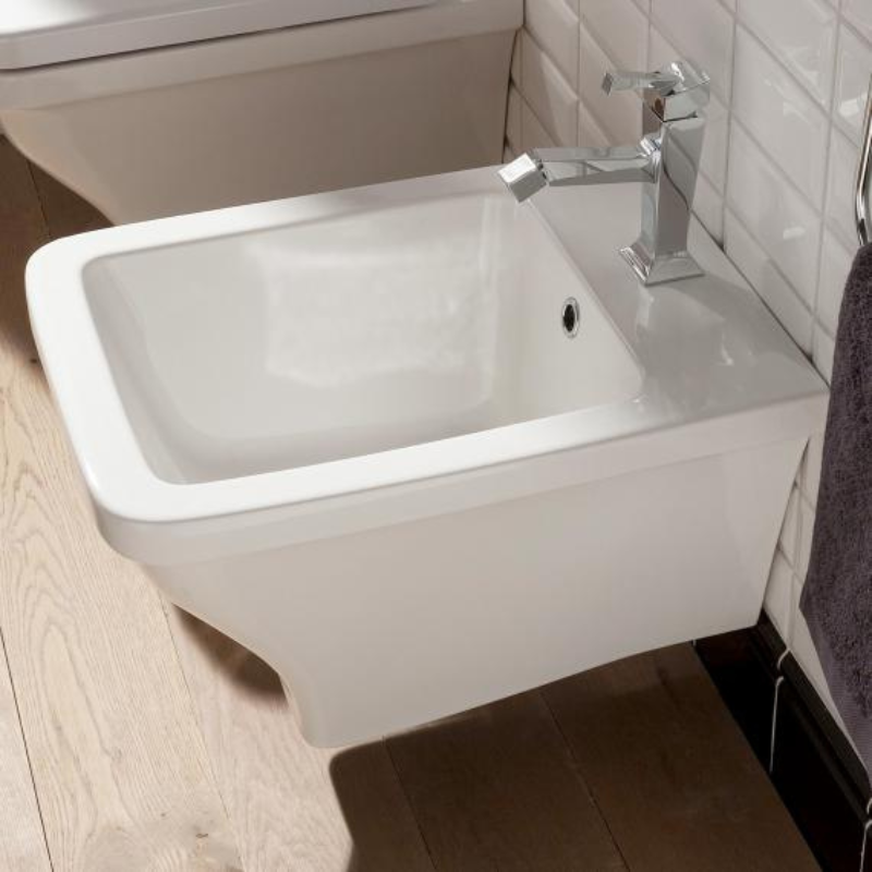 Scarabeo Butterfly wall mount bidet installed in premium bathroom Pakistan — Butterfly suite, Sardar & Co
