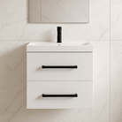 Installed view of the best bathroom cabinet price unit with white countertop, black fixtures, and mirror on tile wall.