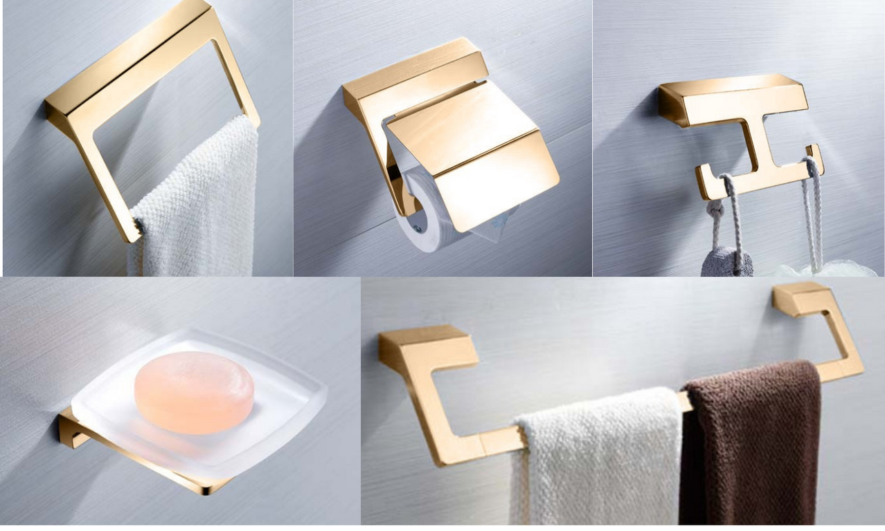 A set of gold-colored bathroom accessories set including a toilet paper holder, a towel rack, and other items.