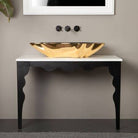 Close-up of SHELL designer washbasin – modern luxury sink with bold black and gold finish