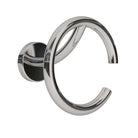 A silver wall hook with a circular design mounted on a white background.