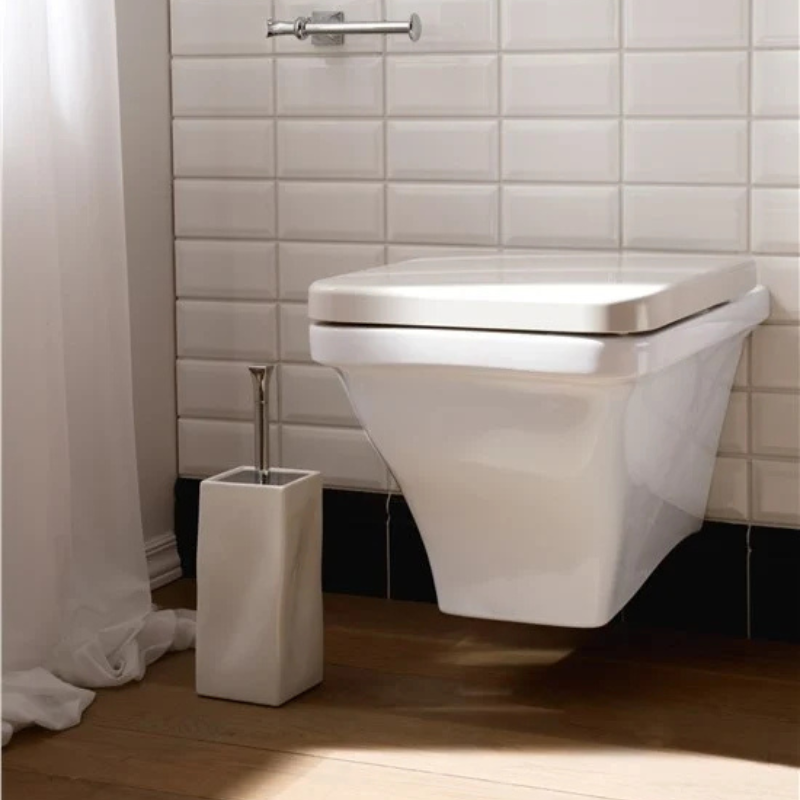 Scarabeo Butterfly wall mount WC installed in premium bathroom Pakistan — Butterfly suite, Sardar & Co