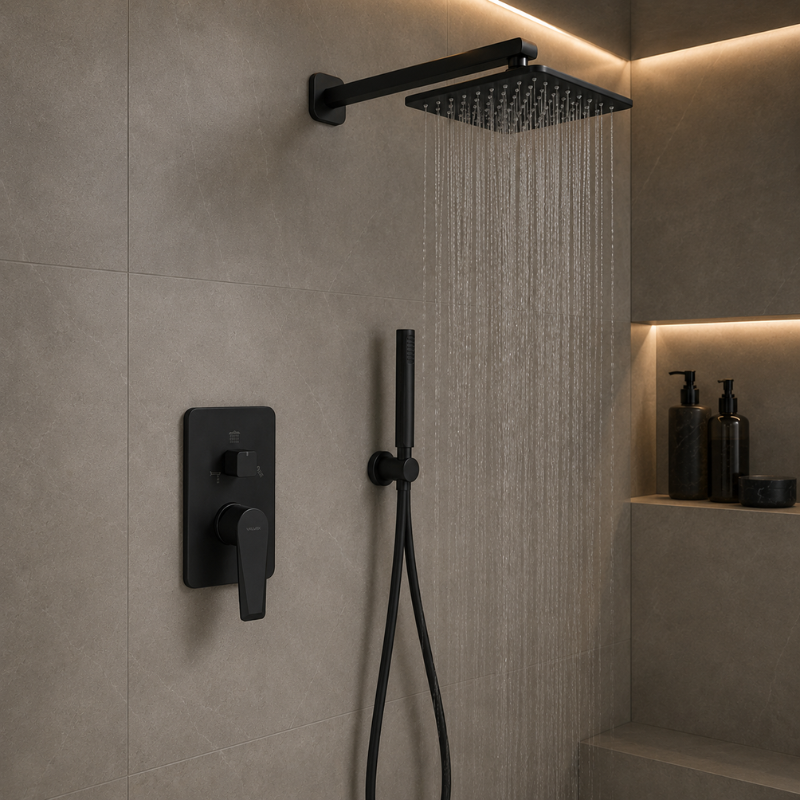 Black shower head and control panel mounted on a tiled wall with a modern shower setup.